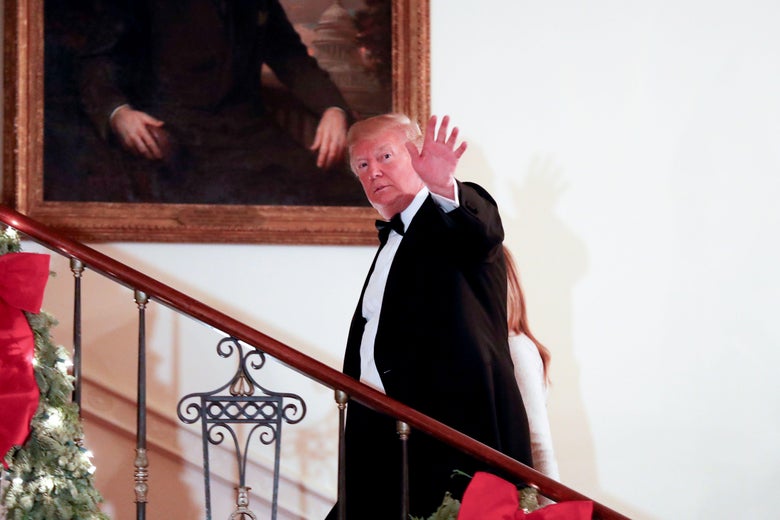 President Donald Trump waves after greeting guests during the Congressional Ball at the White House on December 15, 2018.